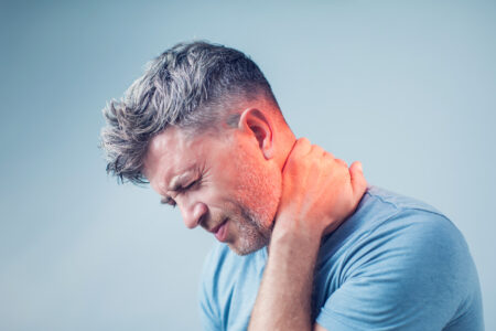 Young man suffering from neck pain. Headache pain.