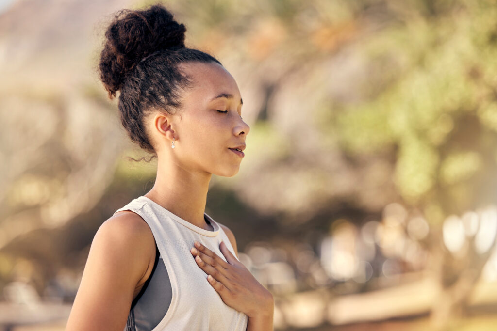 Woman expressing gratitude through meditation